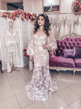 ---Semitransparent wedding dress in tulle and lace decorated with small pearls and sequins that create a seductive combination--